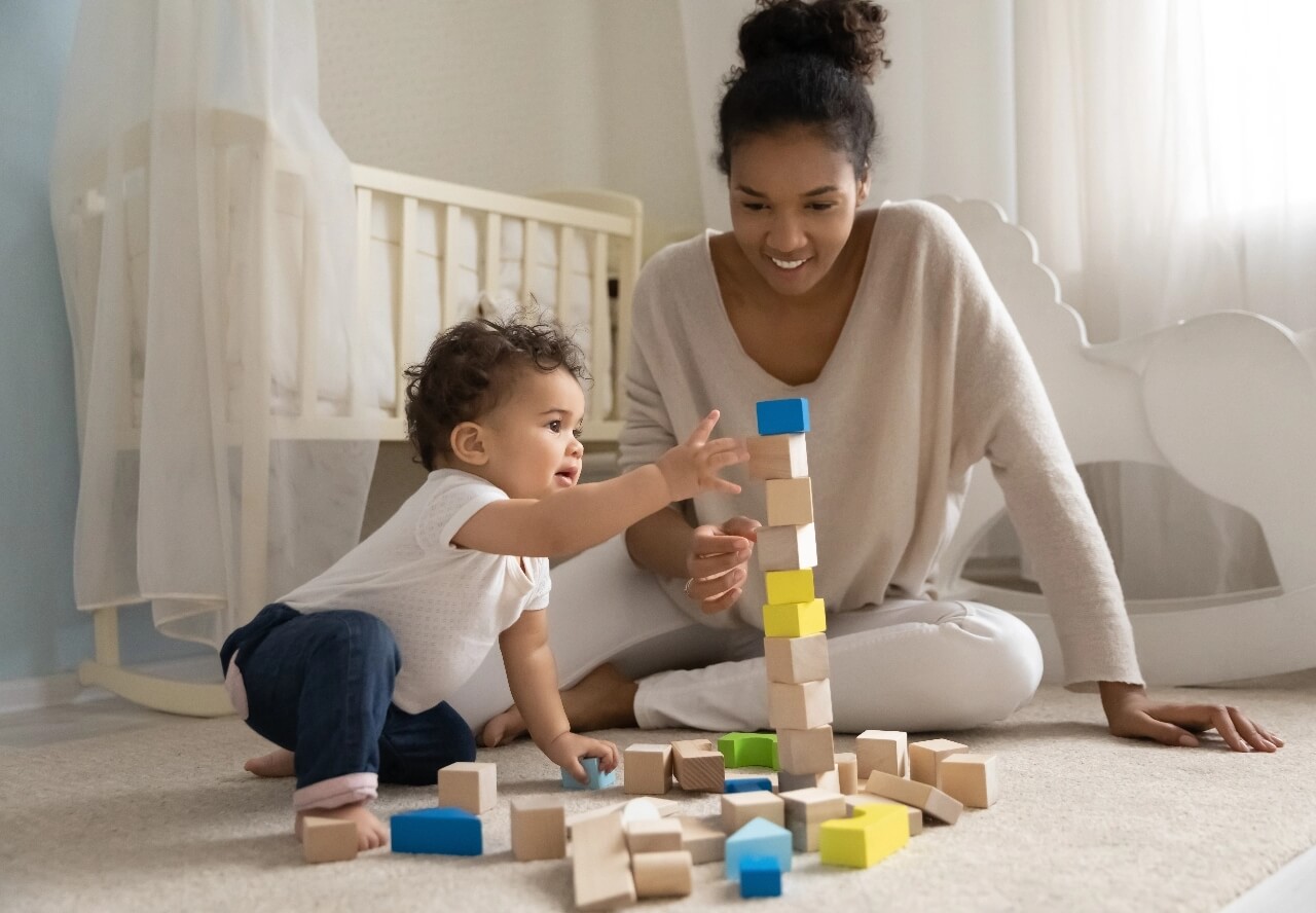 Mom and child playing with blocks