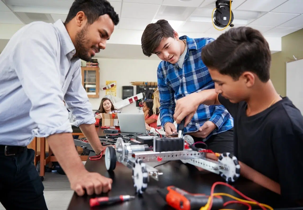 Teacher offering learning support to young child