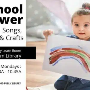 Child holding painting of rainbow with words, Preschool Power Storytime